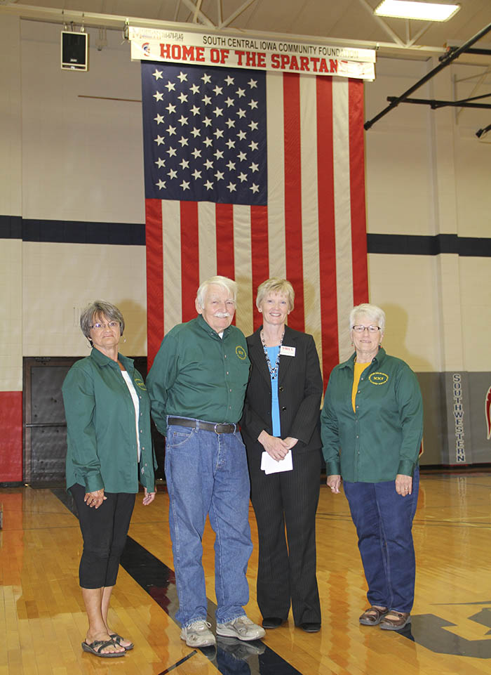 SCICF board members with Dr. Barb Crittenden in front of flag