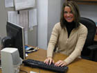 Meghan Cavanaugh at desk