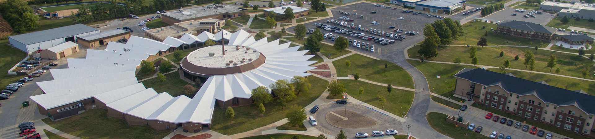 Aerial view of campus looking over the Instructional Center with student housing on the right and the technical centers in the background