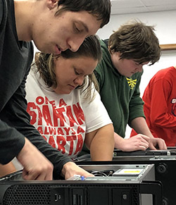 Students working on computer hard drives