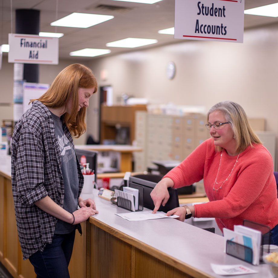 Student receiving assistance from employee in student accounts