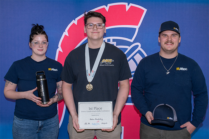 First place winner Andrew Brandenburg with business representatives