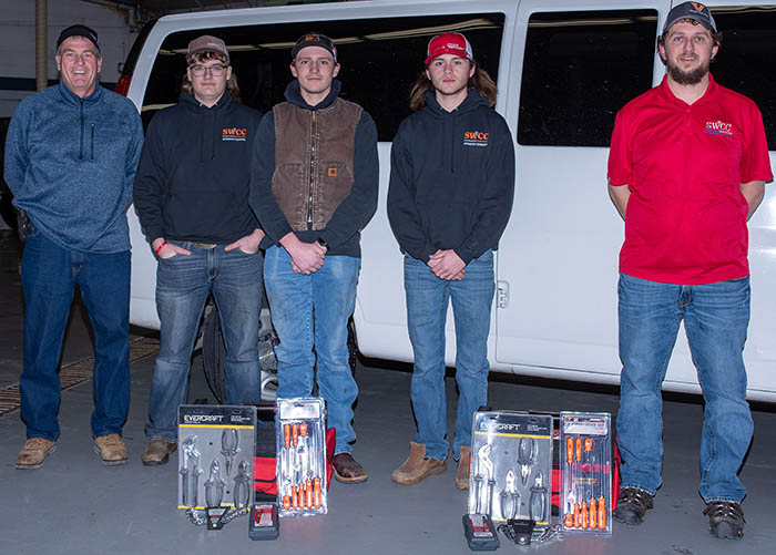 Students with instructors and prizes