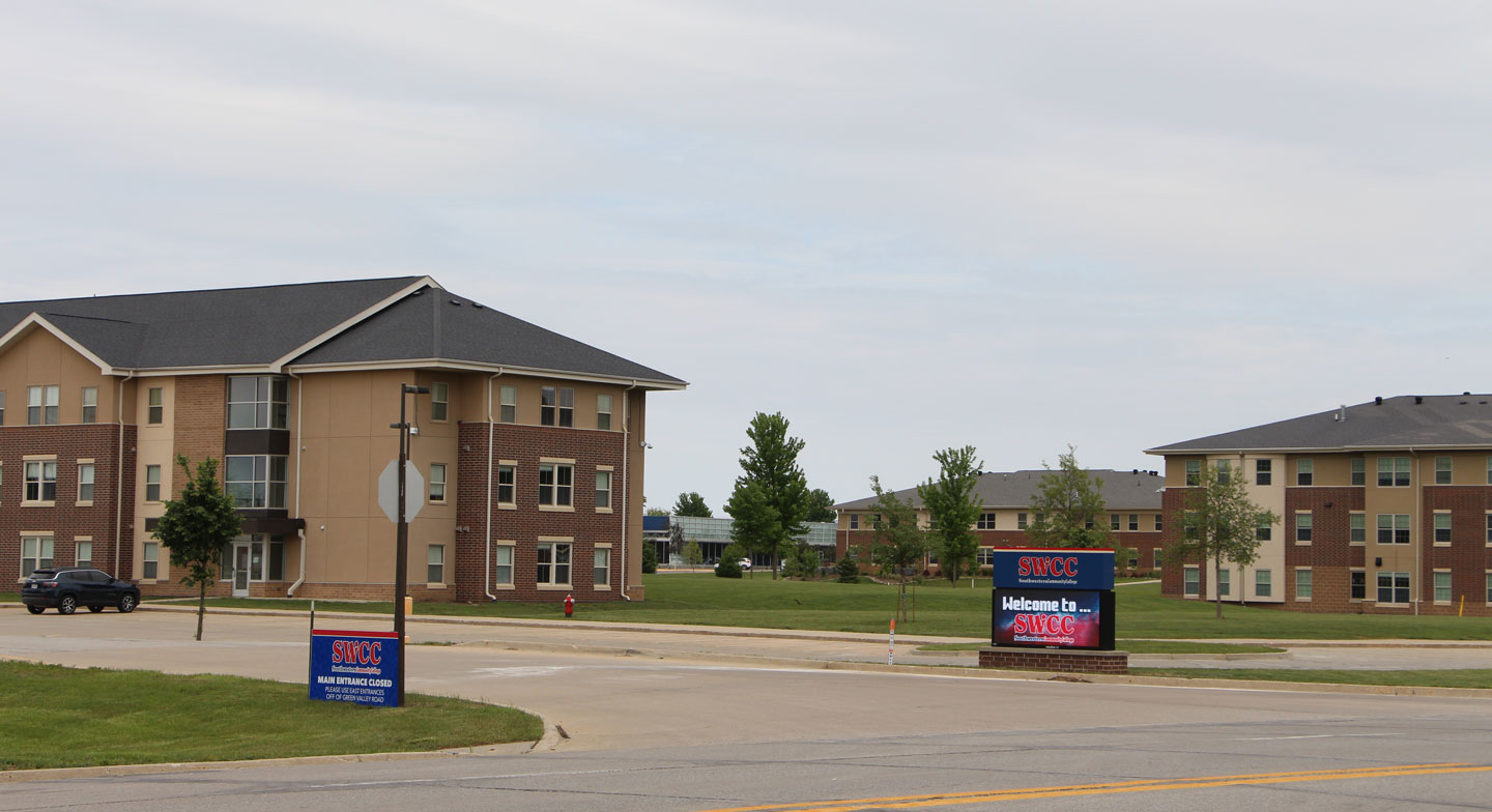 View of main entrance looking north with student housing in the background