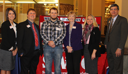 SWCC Group posing in front of display table