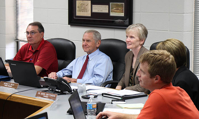 Ken Rech presiding over board meeting