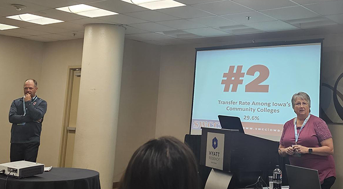 Kim Oaks presenting with Wayne Pantini in the background