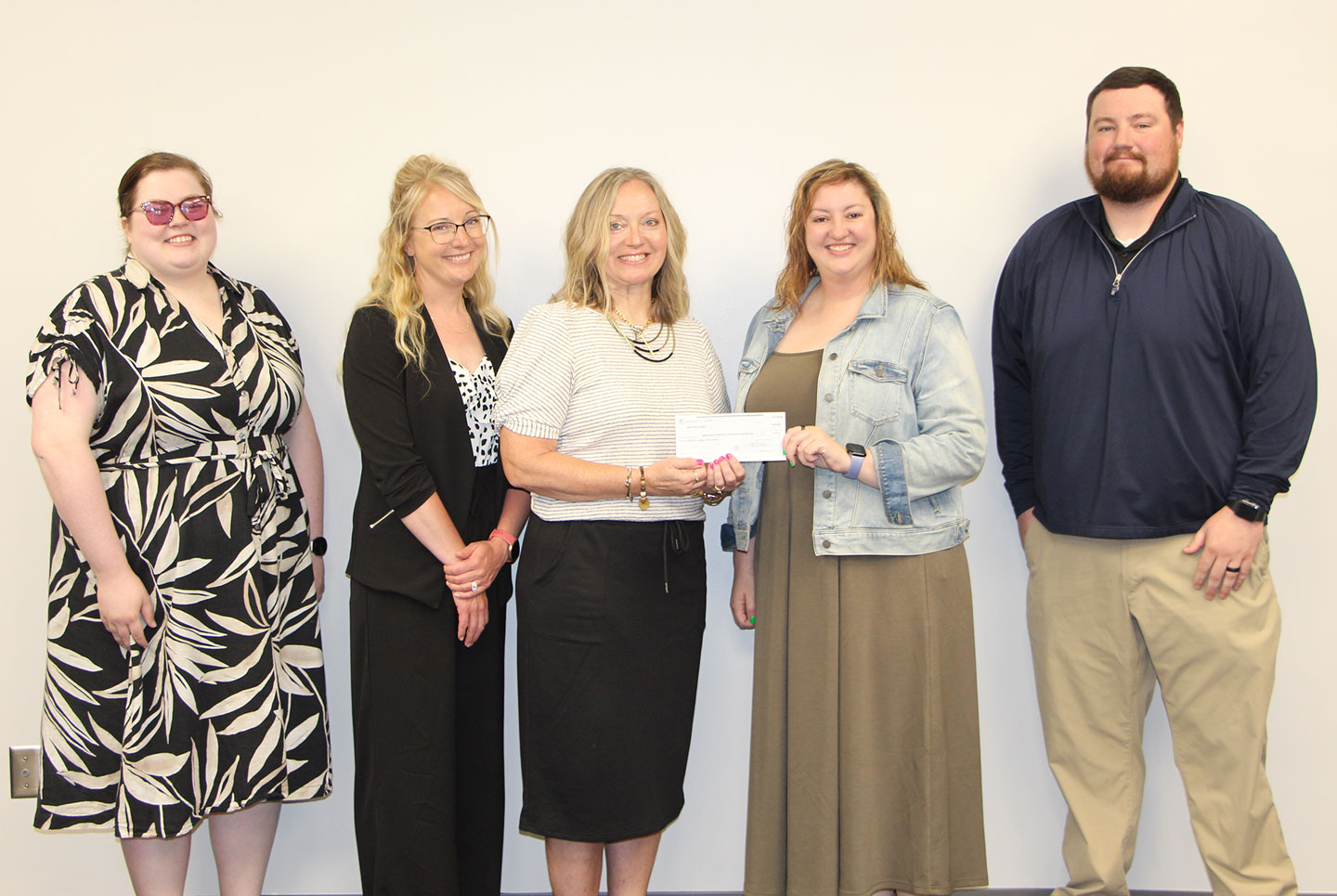 Hailey Walker, universal banker 2, Northwest Bank; Lauren England and Terri Higgins, SWCC employees and Out of the Darkness Walk coordinators; Amara Huffine, area director, Iowa, American Foundation for Suicide Prevention; and Nathan Haley, Northwest Bank, loan portfolio manager.