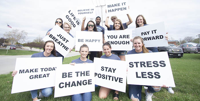 2019 Operation PIF crew with inspirational message signs