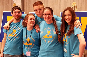SWCC students posing in PTK T-shirts at conference