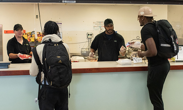 Students ordering at Spartan Cafe short order window