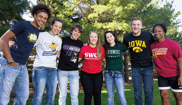 Students dressed in shirts from their transfer colleges