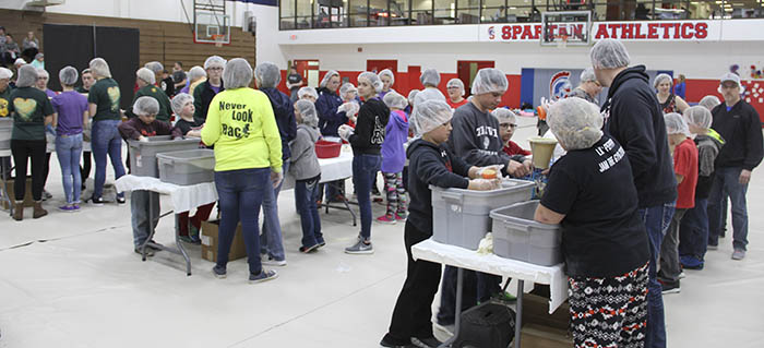 Volunteers packaging meals at Meals from the Heartland 2018