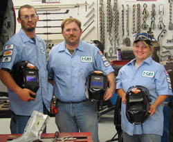 students holding helmets