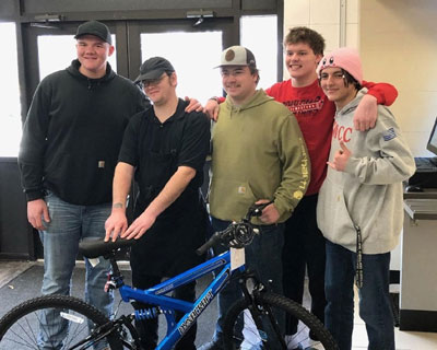 Students in Spartan Cafe with bike donation