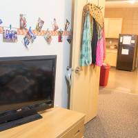 Single room furnished with many photos and TV