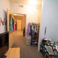 Single furnished room bed, dresser, TV, and other decorations