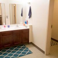 Shared prep area with dual sinks and mirrors.